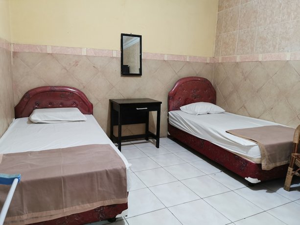 Imagen de la habitación del Hotel Al Hakim Syariah. Foto 9