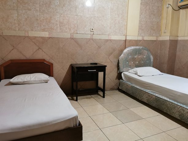 Imagen de la habitación del Hotel Al Hakim Syariah. Foto 10