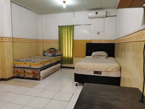 Imagen de la habitación del Hotel Al Hakim Syariah. Foto 12