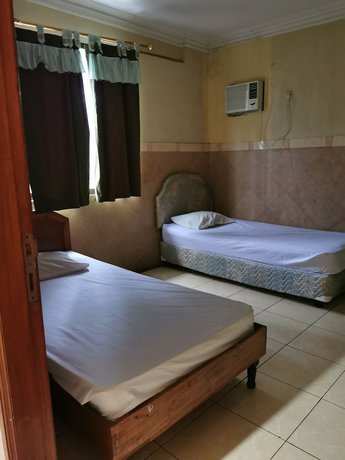 Imagen de la habitación del Hotel Al Hakim Syariah. Foto 16