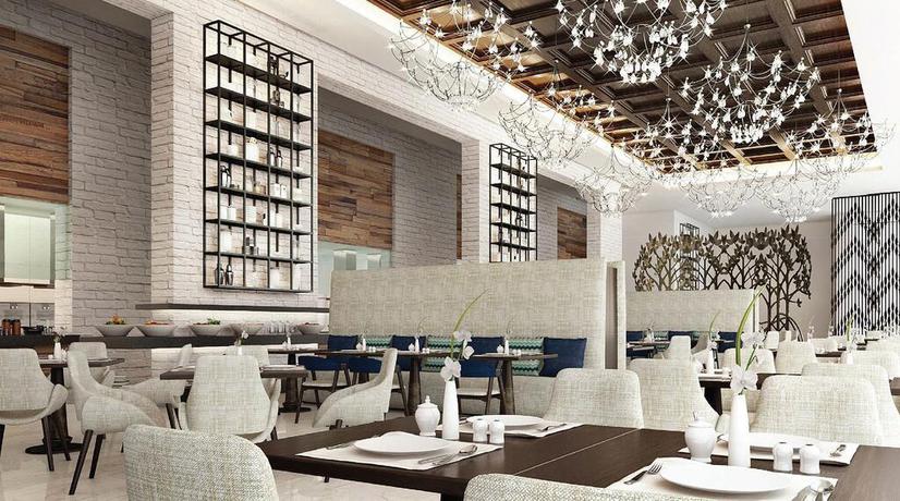 Imagen del bar/restaurante del Hotel Al Jaddaf Rotana Suite. Foto 2