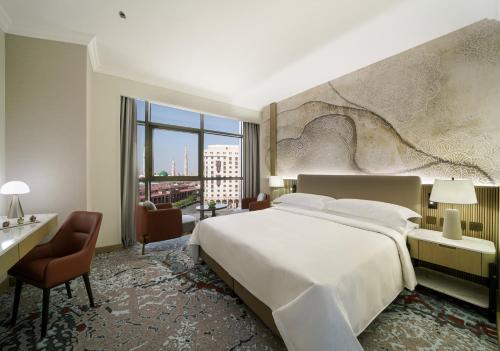 Imagen de la habitación del Hotel Al Manakha Rotana Madinah. Foto 19