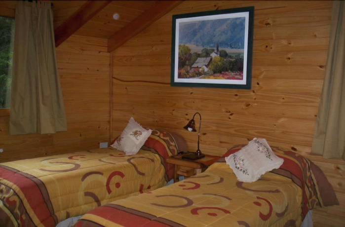 Imagen de la habitación del Hotel Alamos De Meli Tue Caba&ntilde;as. Foto 17