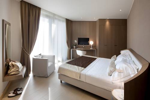 Imagen de la habitación del Hotel Albarella Golf. Foto 9