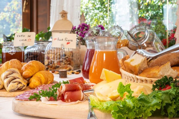 Imagen del bar/restaurante del Hotel Albergo Alla Posta, Sant'Antonio di Mavignola. Foto 5