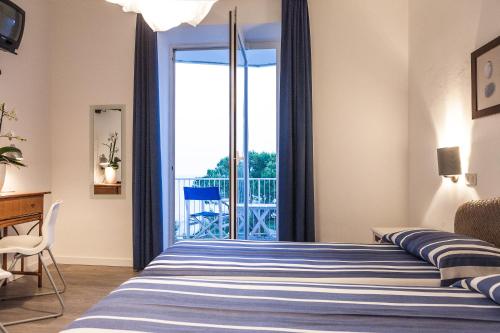Imagen de la habitación del Hotel Albergo Alla Spiaggia. Foto 10