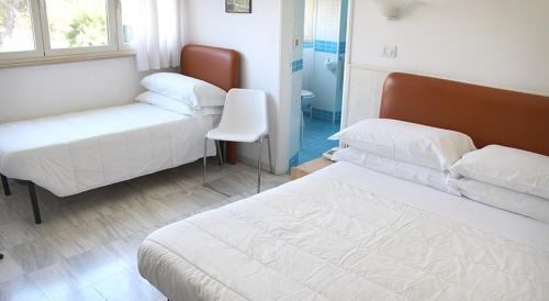 Imagen de la habitación del Hotel Albergo Dei Pini. Foto 20