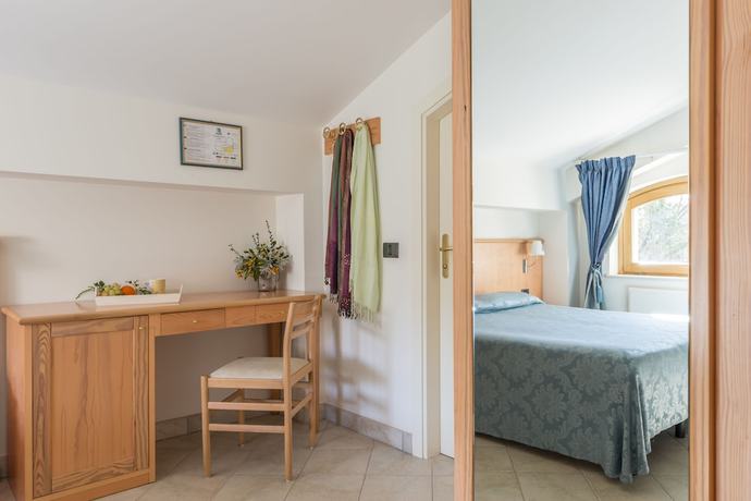 Imagen de la habitación del Hotel Albergo Il Giardino del Rio. Foto 6