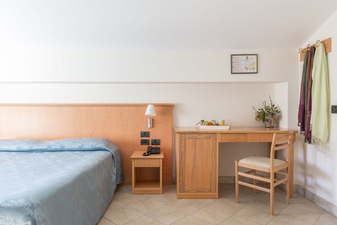 Imagen de la habitación del Hotel Albergo Il Giardino del Rio. Foto 14
