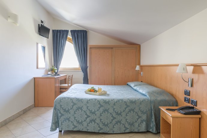 Imagen de la habitación del Hotel Albergo Il Giardino del Rio. Foto 17