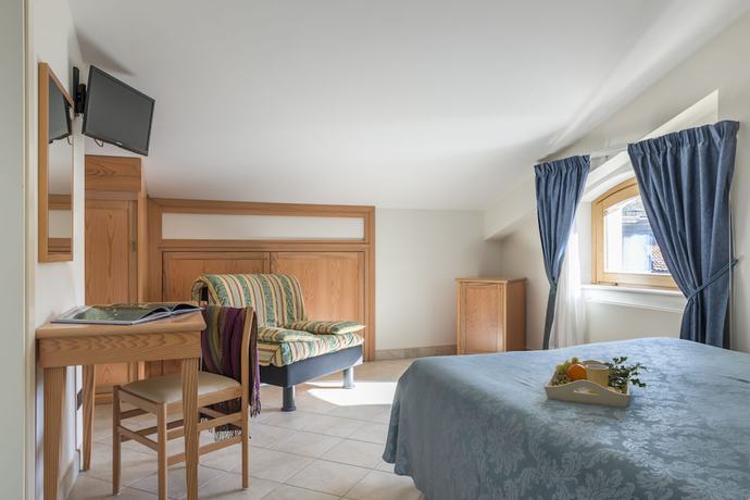 Imagen de la habitación del Hotel Albergo Il Giardino del Rio. Foto 18