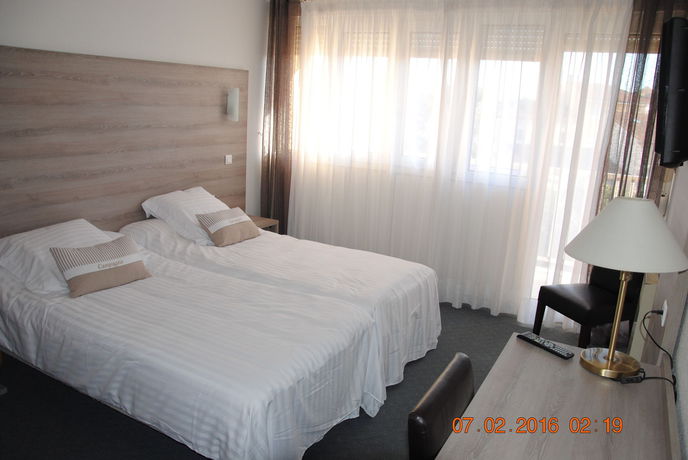 Imagen de la habitación del Hotel Albizzia. Foto 4