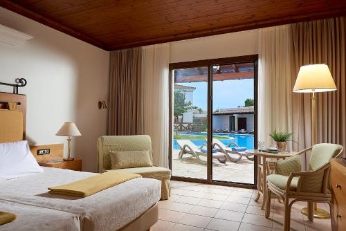 Imagen de la habitación del Hotel Aldemar Olympian Village. Foto 8