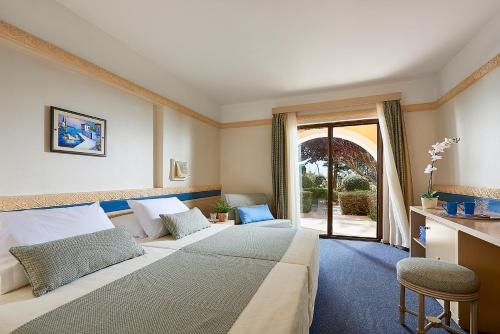 Imagen de la habitación del Hotel Aldemar Olympian Village. Foto 9