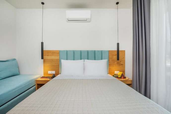 Imagen de la habitación del Hotel AlexMare Fourka. Foto 15