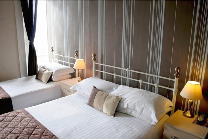 Imagen de la habitación del Hotel Alexander's. Foto 10