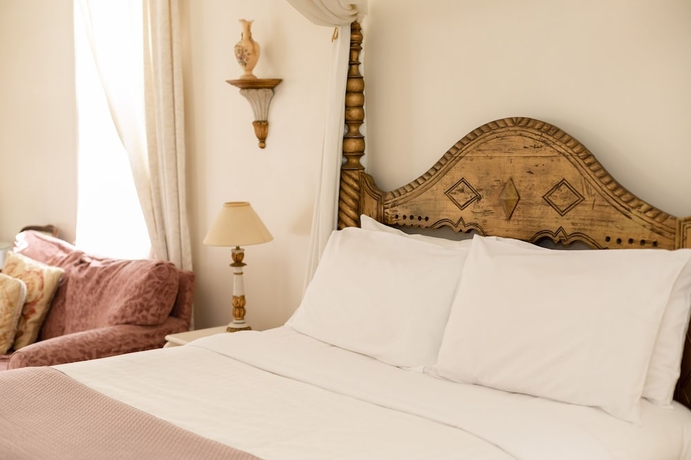 Imagen de la habitación del Hotel Alice's Cottages. Foto 9