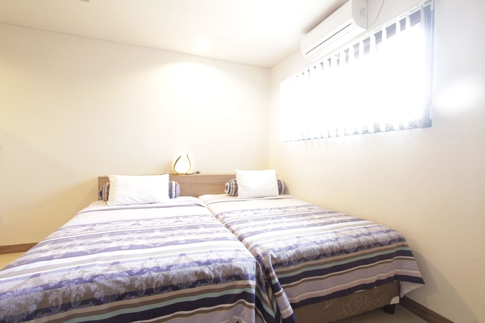 Imagen de la habitación del Hotel Alit Beach Resort and Villas. Foto 8