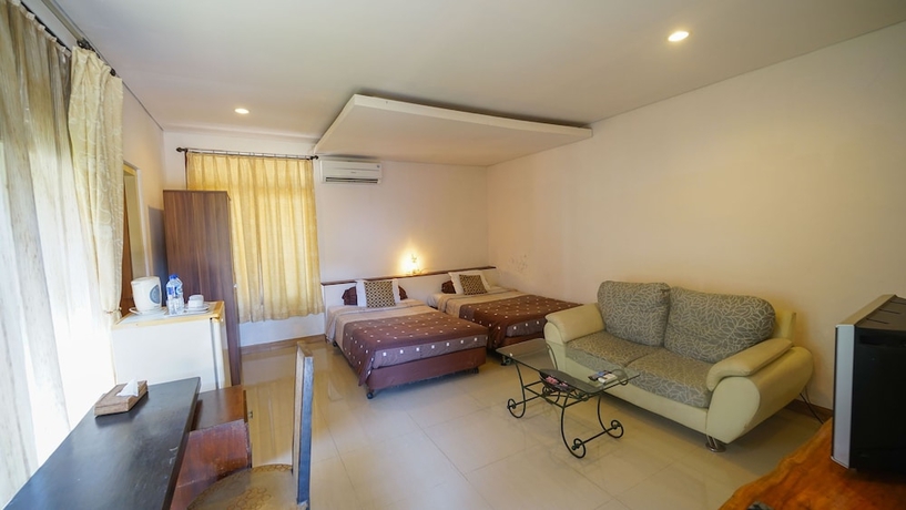 Imagen de la habitación del Hotel Alit Beach Resort and Villas. Foto 18