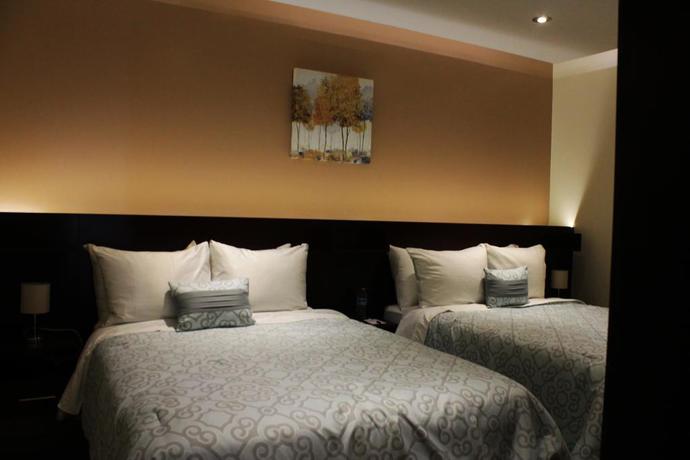 Imagen de la habitación del Hotel All Days Inn and Out. Foto 5