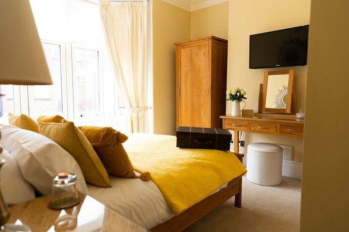 Imagen de la habitación del Hotel All Seasons Boutiques. Foto 18