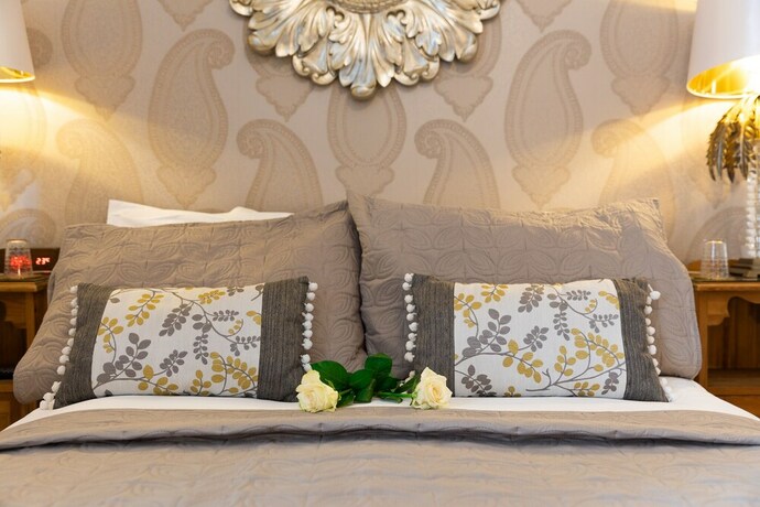 Imagen de la habitación del Hotel All Seasons Boutiques. Foto 19