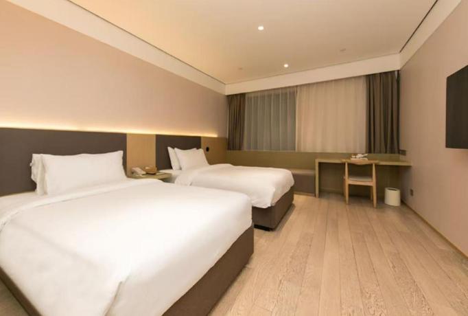Imagen de la habitación del Hotel All Seasons Shanghai Lujiazui Pudong Avenue. Foto 4