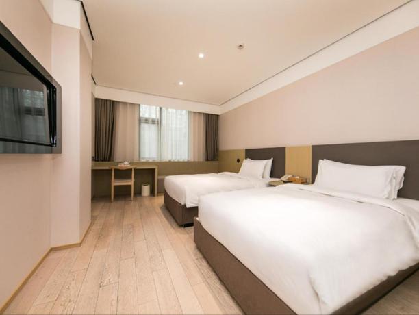 Imagen de la habitación del Hotel All Seasons Shanghai Lujiazui Pudong Avenue. Foto 5