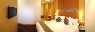 Imagen de la habitación del Hotel All Sedayu Jakarta. Foto 17