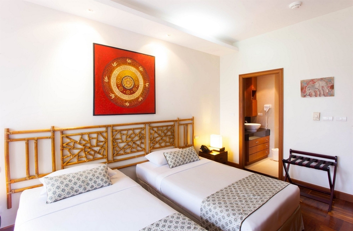 Imagen de la habitación del Hotel Allamanda Laguna Phuket. Foto 14