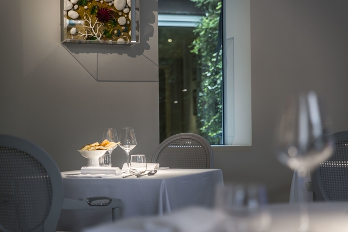 Imagen del bar/restaurante del Hotel Alli Due Buoi Rossi. Foto 10