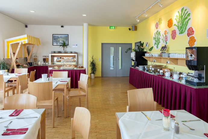 Imagen del bar/restaurante del Hotel Allyouneed Salzburg. Foto 2