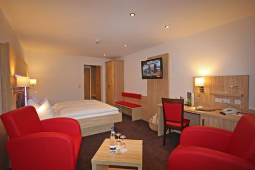 Imagen de la habitación del Hotel Alm- and Wellnesshotel Alpenhof. Foto 5