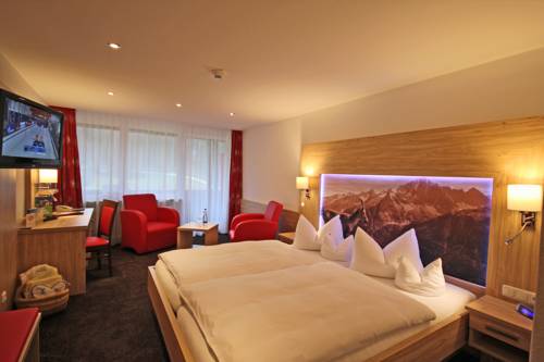 Imagen de la habitación del Hotel Alm- and Wellnesshotel Alpenhof. Foto 8