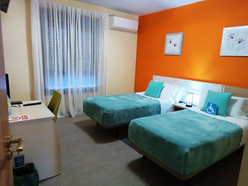 Imagen de la habitación del Hotel Alma Rosa. Foto 11