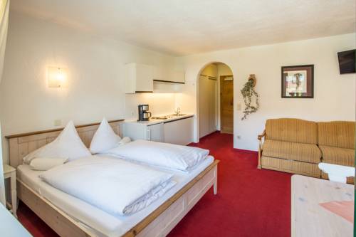 Imagen de la habitación del Hotel Almhof Kitzlodge - Zimmer Suiten Apartments. Foto 6