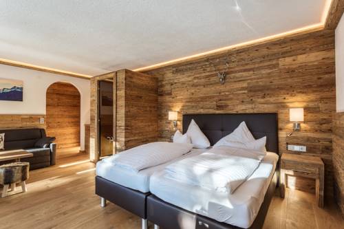 Imagen de la habitación del Hotel Almhof Kitzlodge - Zimmer Suiten Apartments. Foto 9