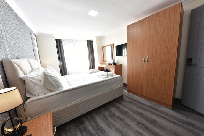 Imagen de la habitación del Hotel Almina Inn. Foto 9