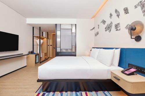 Imagen de la habitación del Hotel Aloft Beijing Huairou, Huairou. Foto 17