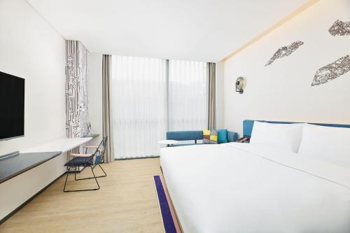 Imagen de la habitación del Hotel Aloft Beijing Huairou, Huairou. Foto 18