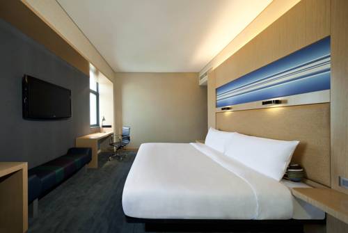 Imagen de la habitación del Hotel Aloft Haiyang. Foto 10
