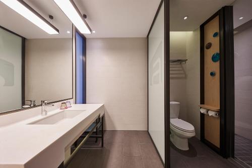 Imagen de la habitación del Hotel Aloft Shanghai Zhangjiang Haike. Foto 3