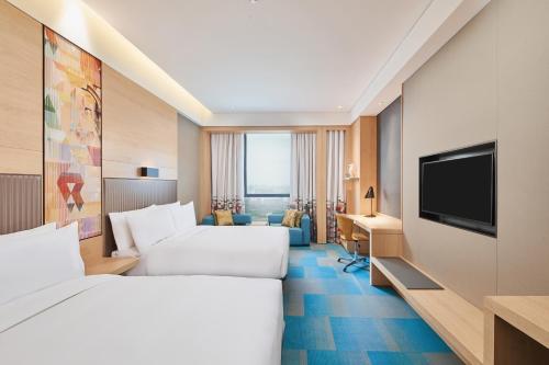Imagen de la habitación del Hotel Aloft Shanghai Zhangjiang Haike. Foto 8