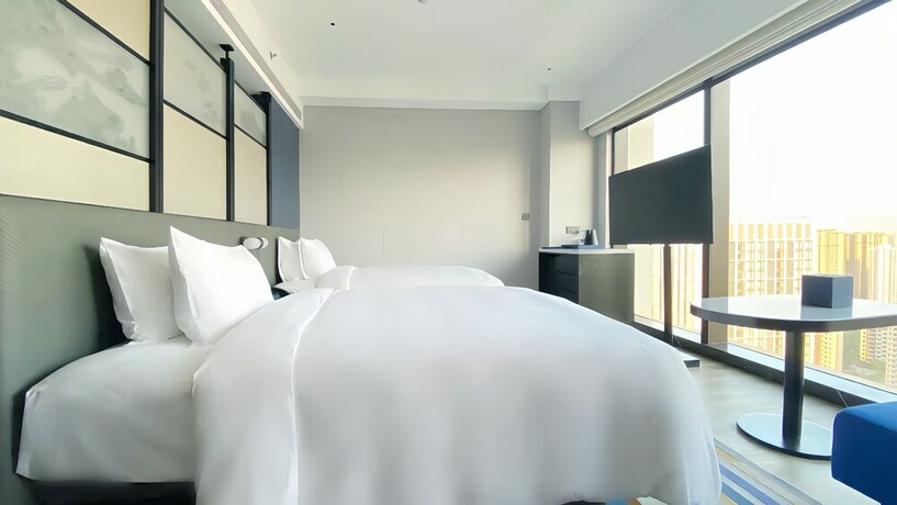 Imagen de la habitación del Hotel Aloft Yantai. Foto 11