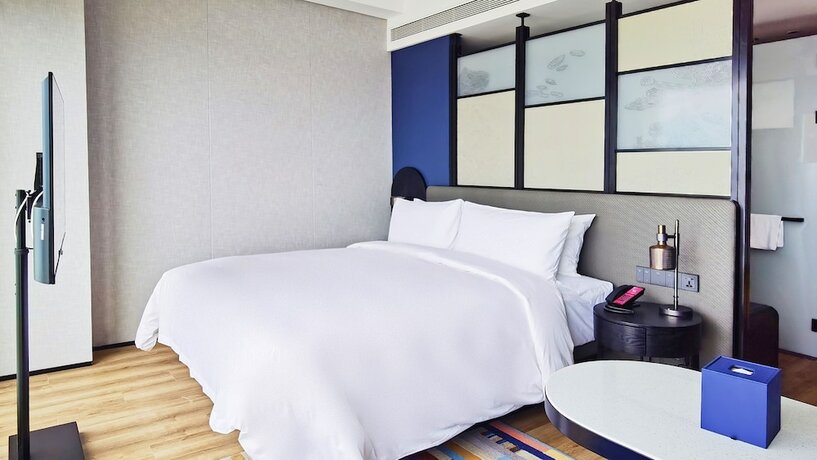 Imagen de la habitación del Hotel Aloft Yantai. Foto 13