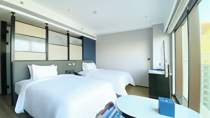 Imagen de la habitación del Hotel Aloft Yantai. Foto 14