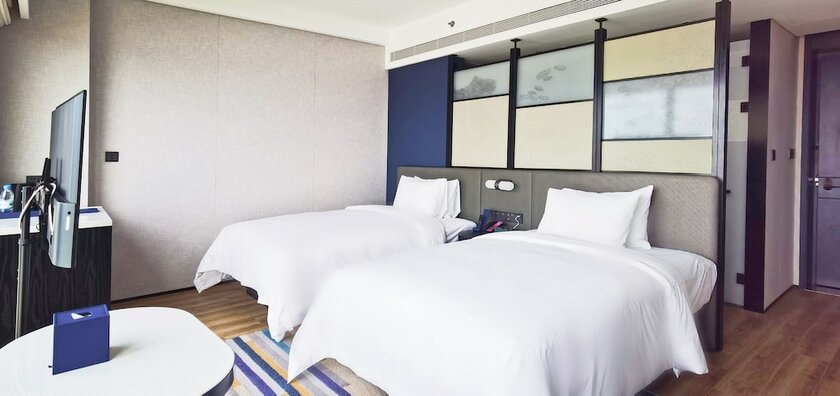 Imagen de la habitación del Hotel Aloft Yantai. Foto 15