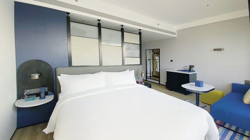 Imagen de la habitación del Hotel Aloft Yantai. Foto 17