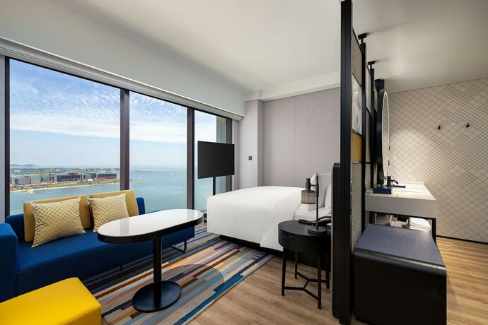 Imagen de la habitación del Hotel Aloft Yantai. Foto 19