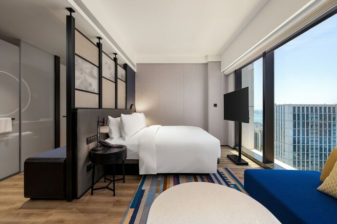 Imagen de la habitación del Hotel Aloft Yantai. Foto 20